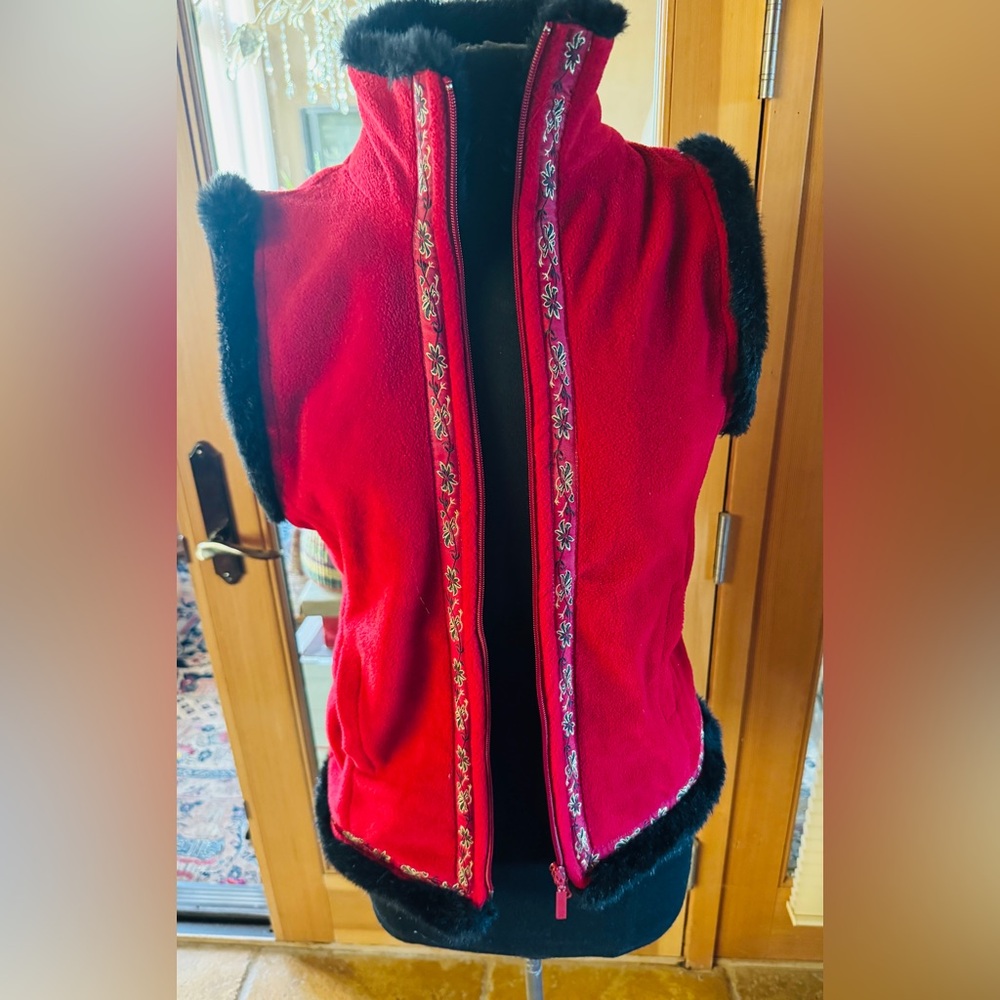 Just in time for the holidays red fleece vest trimmed in black faux fur